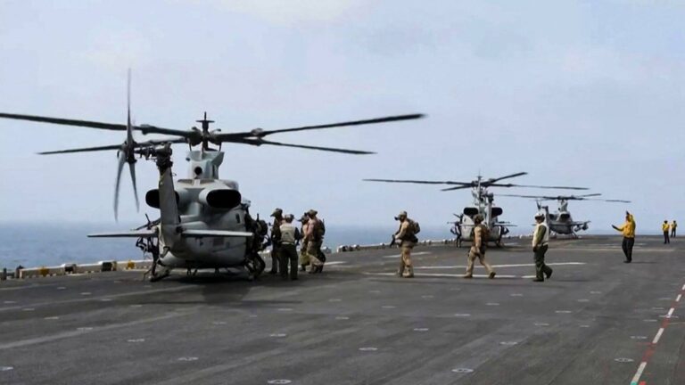 US military helicopters on a ship flight deck