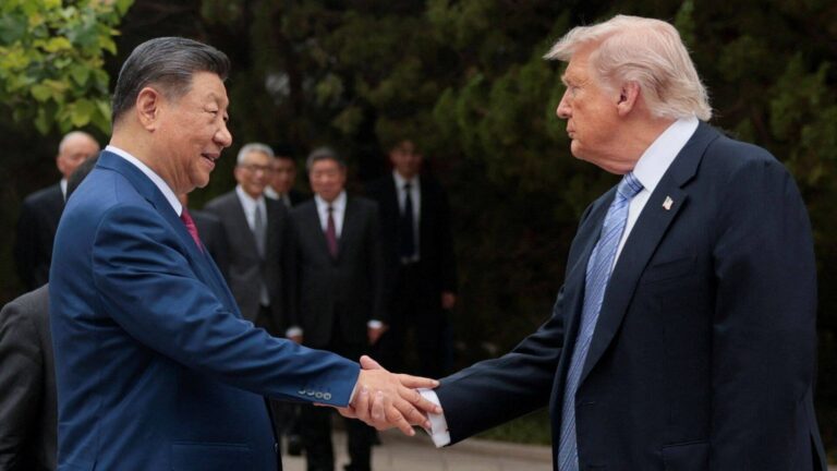 China threatens to cancel Trump-Xi summit over Taiwan arms sale Trump and Xi shake hands in Beijing (file photo)