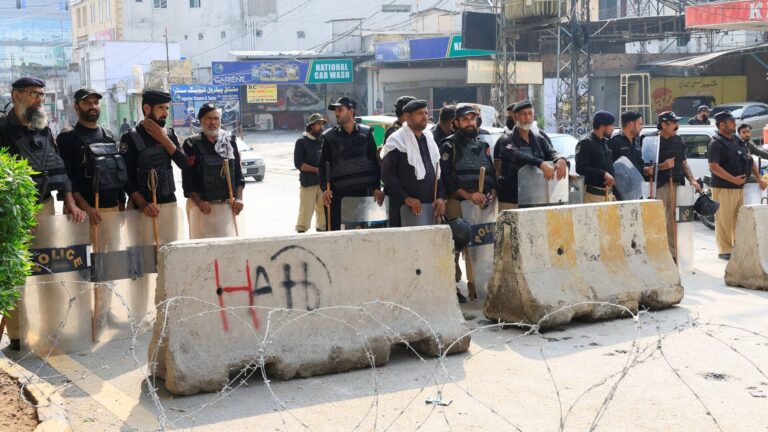 Pakistan declares emergency in Khyber Pakhtunkhwa, suspends Imran Khan’s PTI-led provincial government Police guard a road leading to the Red Zone in Peshawar, Khyber Pakhtunkhwa, Pakistan
